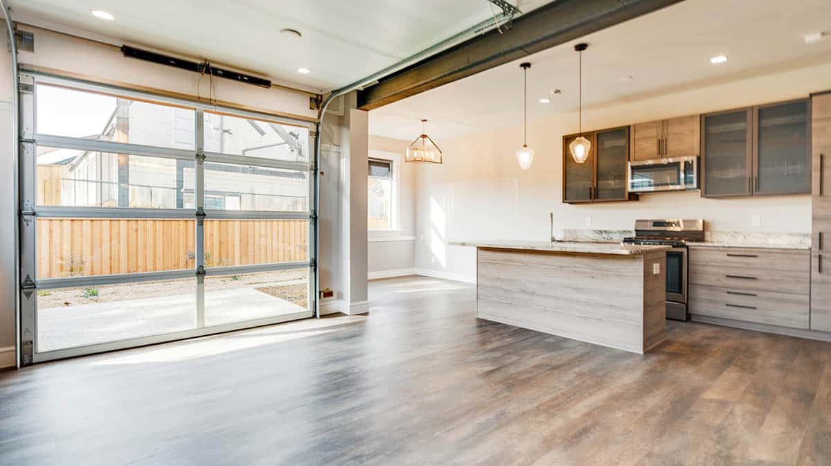 Kitchen with glass roll-up door and open concept design