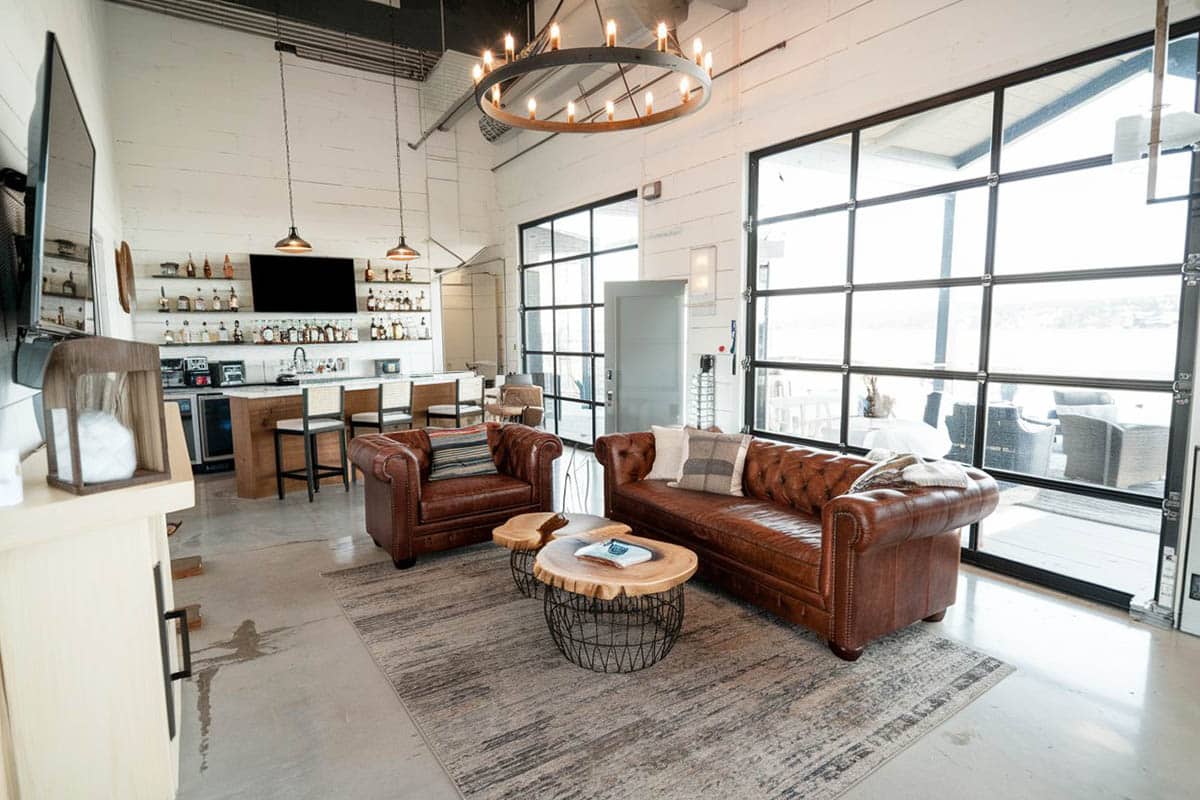 Living room interior with home bar and garage roll up door