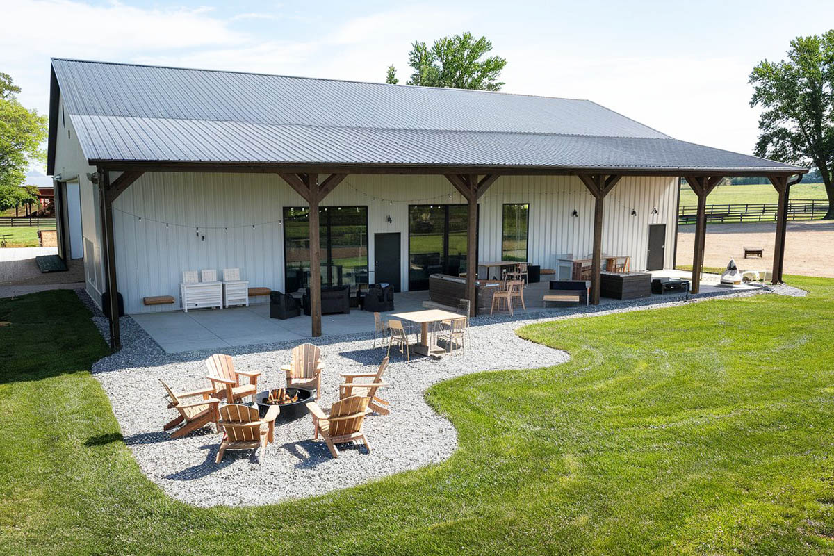 Barndominium home with gravel patio and fire pit