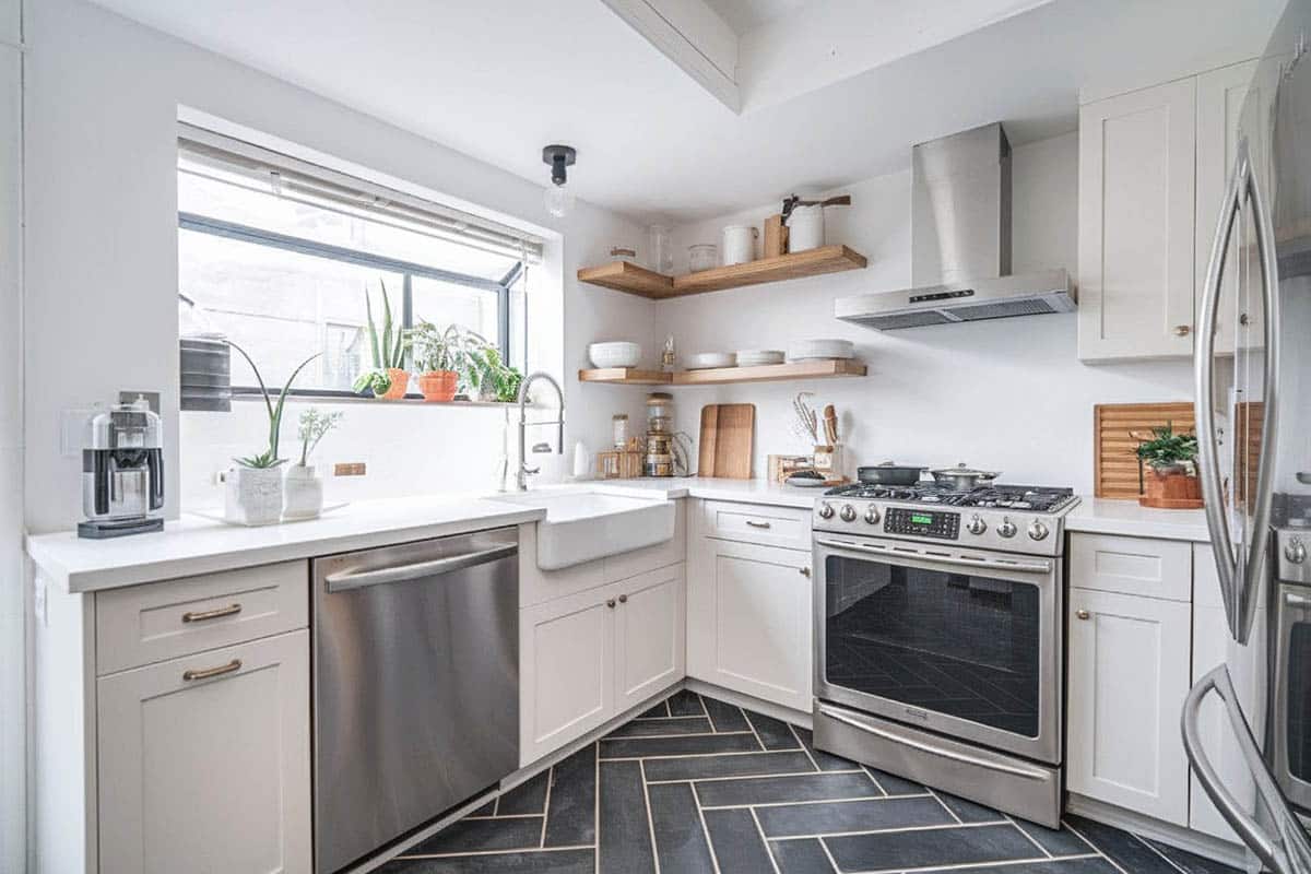 Kitchen garden window with shelf and small plants