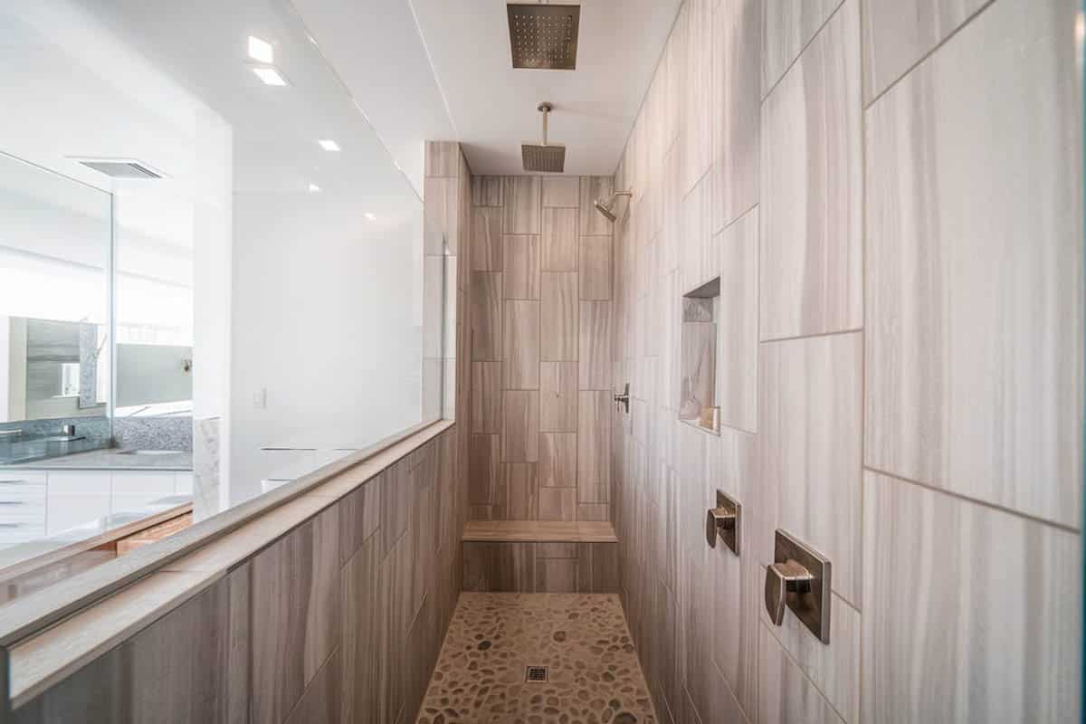 Custom shower with bench and dual shower heads