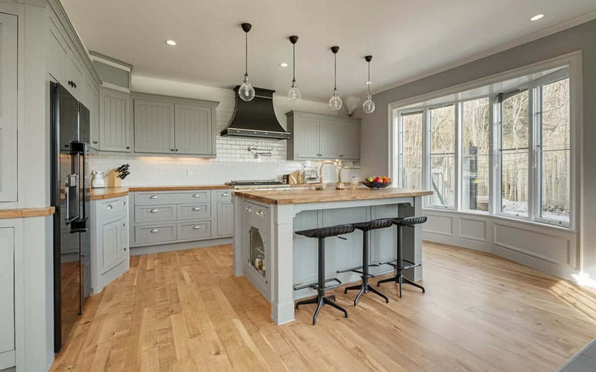 Wood kitchen countertops with hardwood flooring and light gray cabinetry
