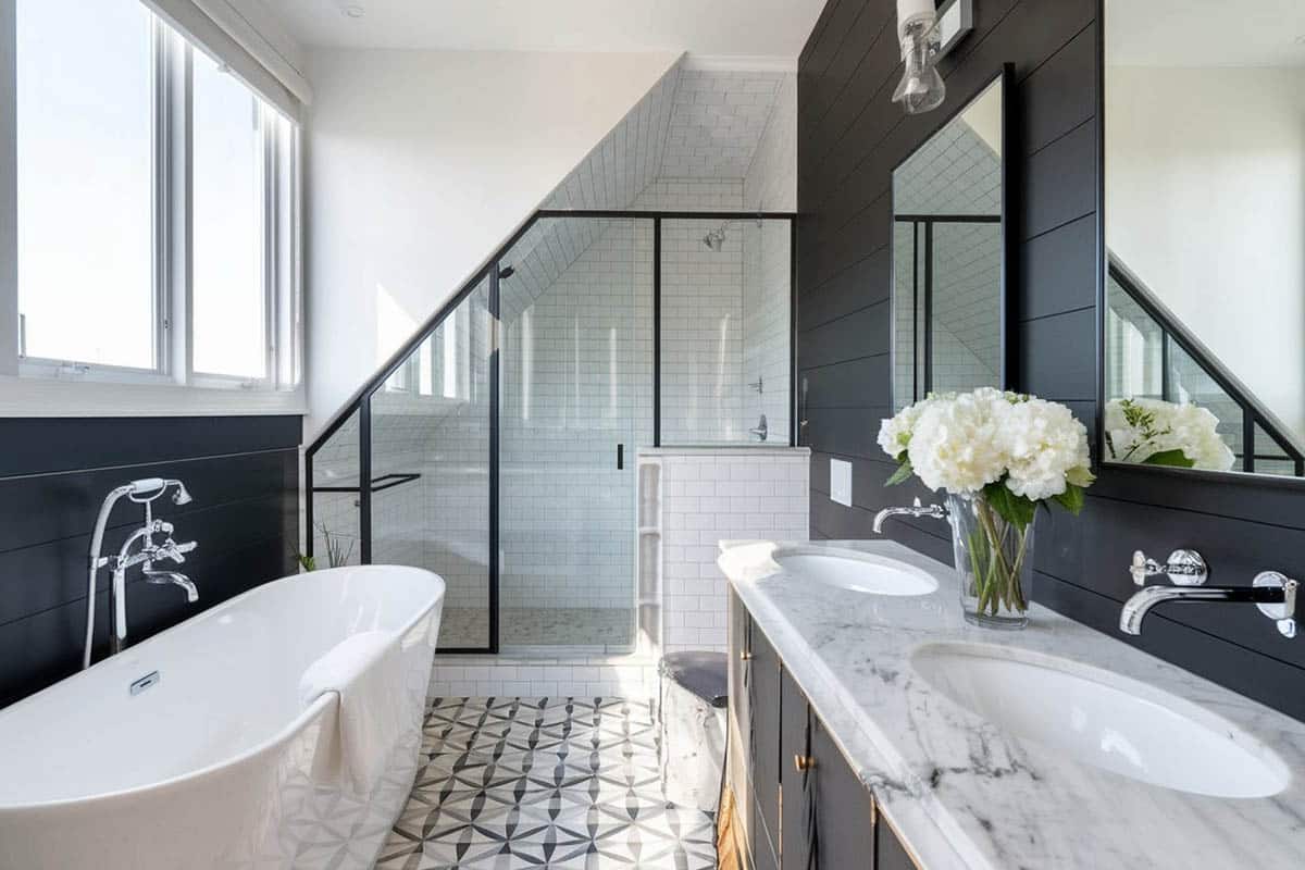 Custom attic shower with angled ceiling and white tiles