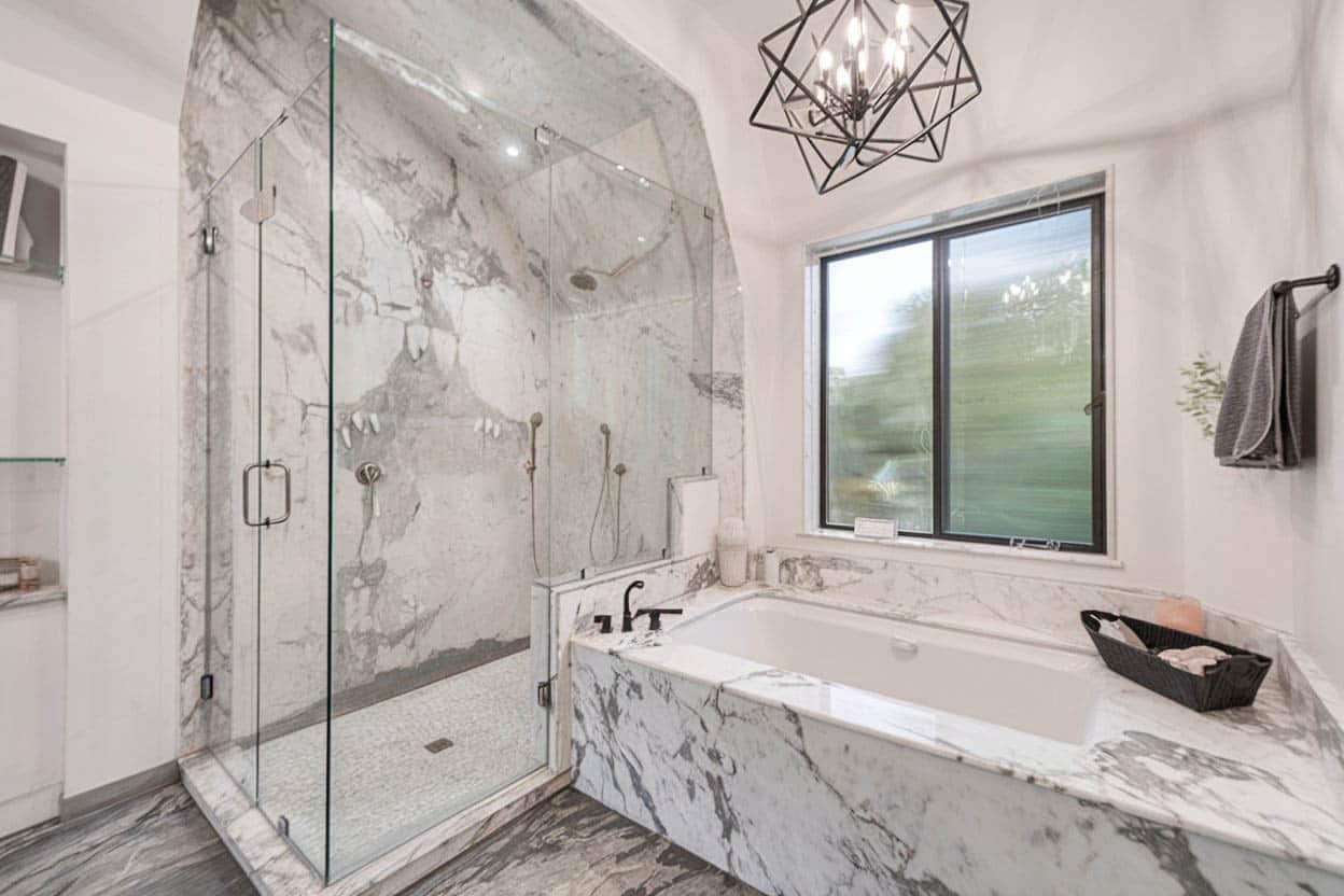 Shower with arched tile ceiling, tub and sliding window