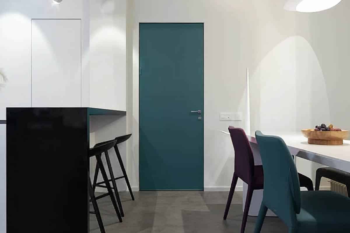 Green metal door in apartment