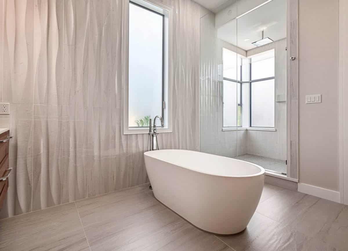 Shower with all-white design and textured wall