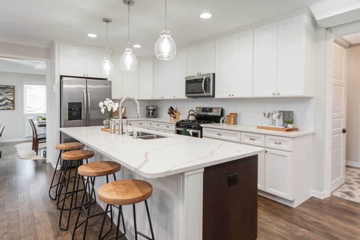 Contemporary kitchen with Carrara White marble countertops