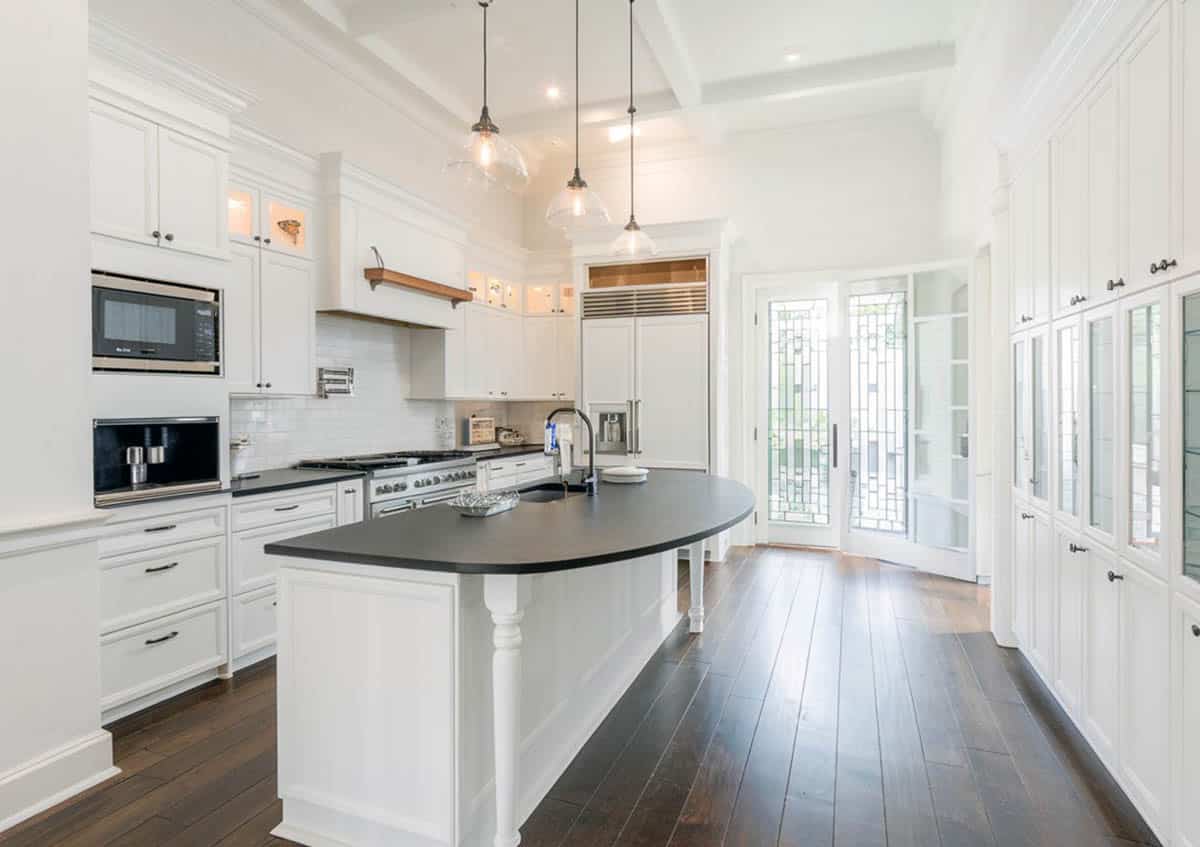 White washed kitchen with black countertop