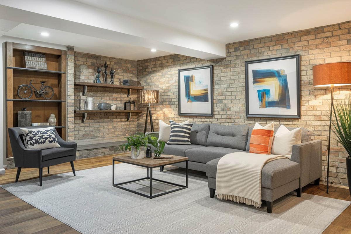 Sectional sofa and wall-mounted shelving with decor
