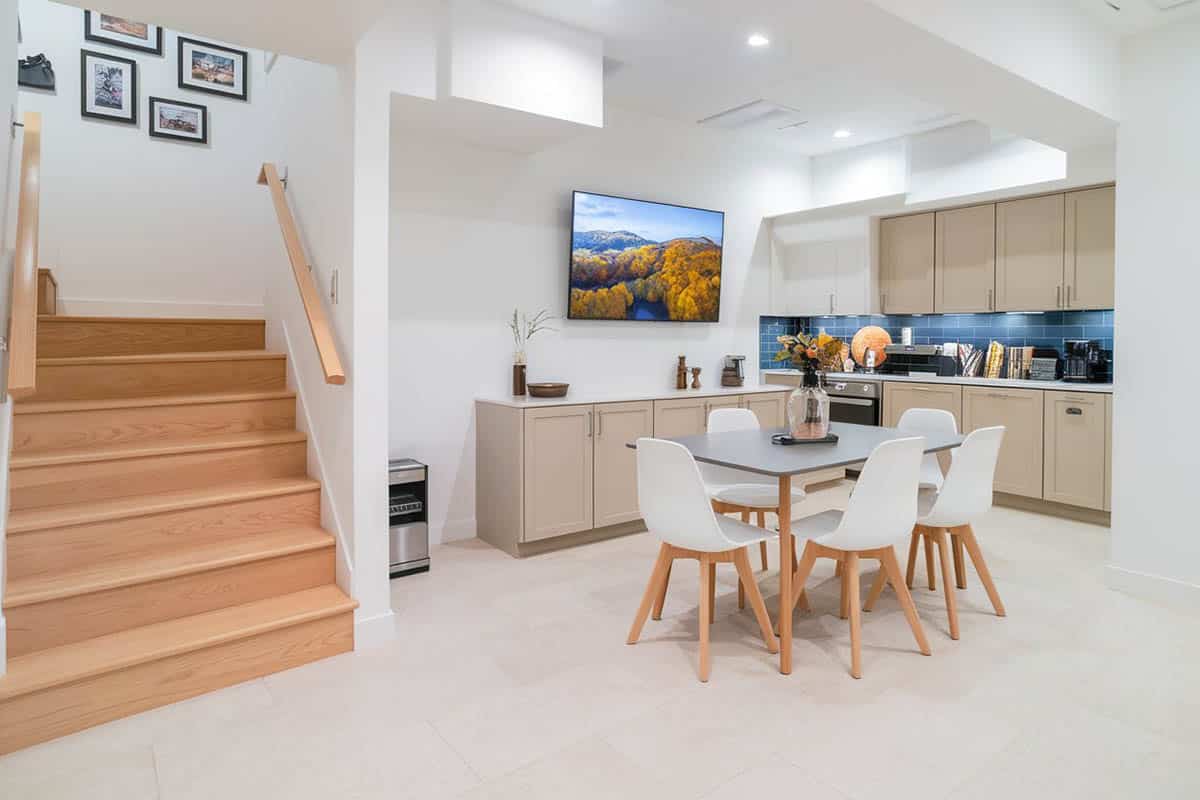 Modern kitchen in the basement with dining set