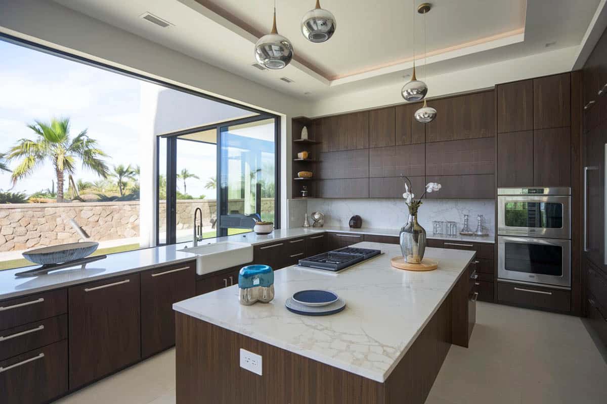 Kitchen with wood flat panel cabinets and white quartz counters