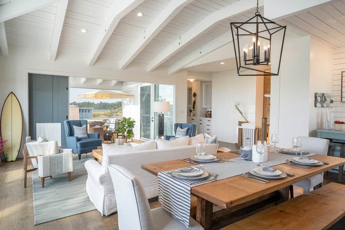 Coastal room with painted plank ceiling and white furniture