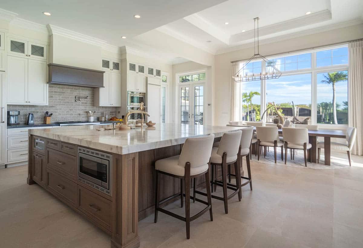 Open floor plan kitchen with extra large island and paneled cabinet doors