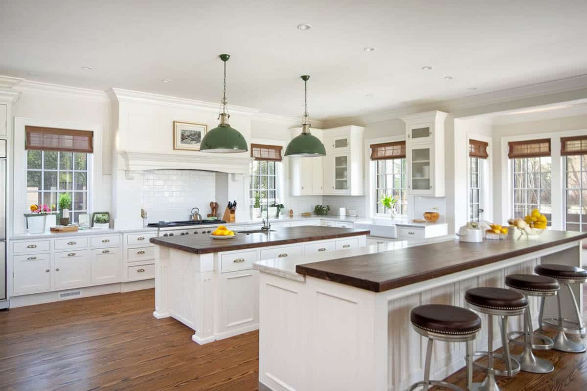 White cabinet kitchen with wood counter breakfast bar island with aro stool seats