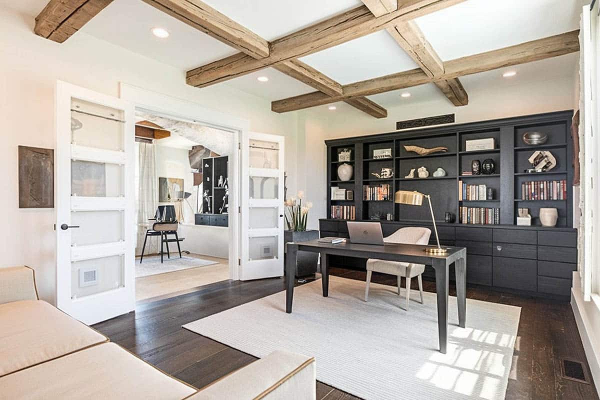 Black wall shelf, double doors and exposed beams