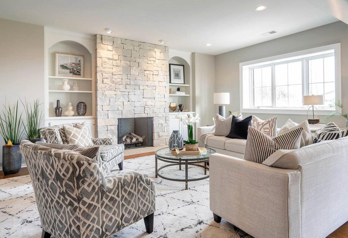 Room with slate wall, upholstered sofa and light gray walls