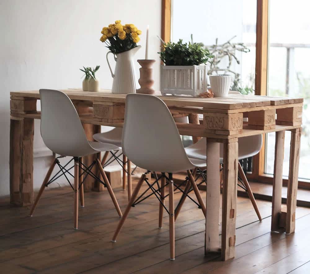 Custom pallet table with modern chairs