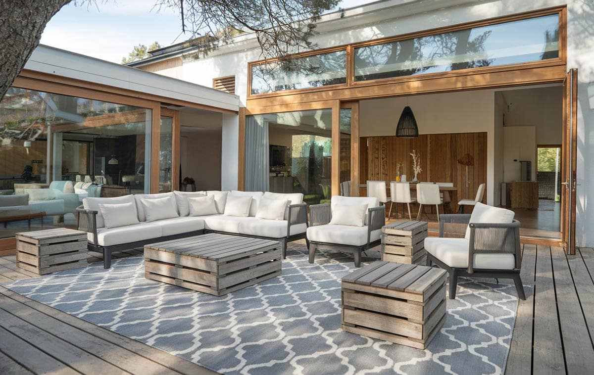 Wood deck with outdoor wooden tables and seating