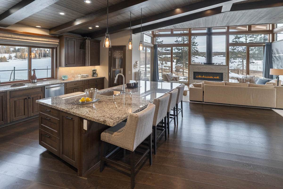 Craftsman kitchen with pendant lights and view of the living room with white sectional