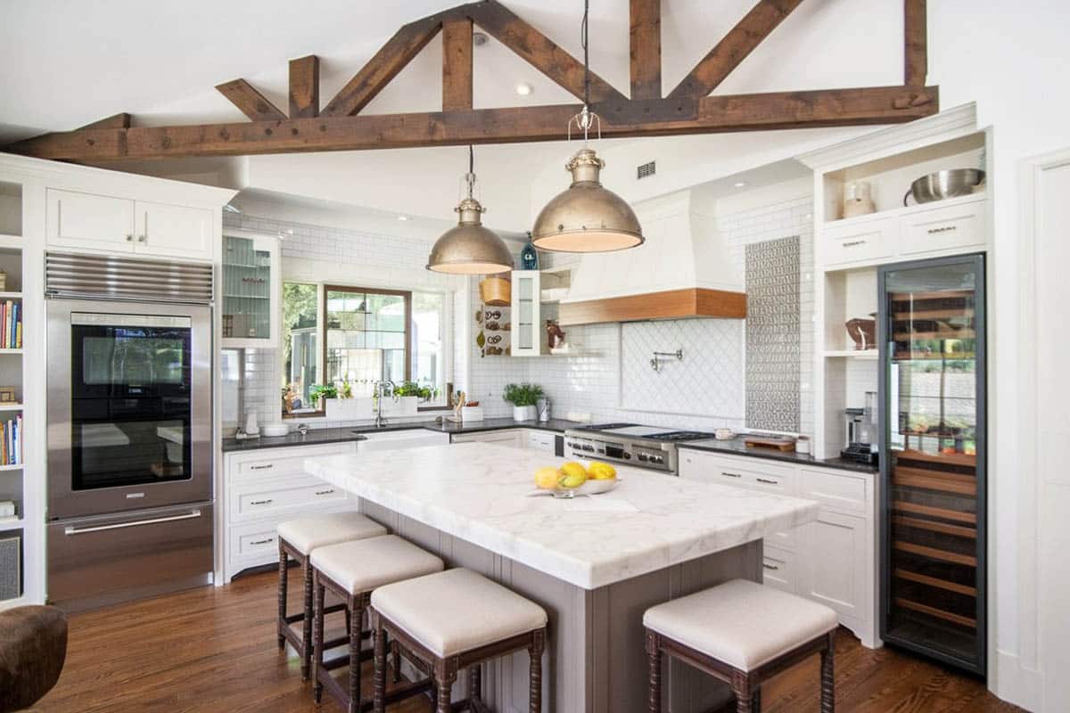 Cape cod kitchen design with white shaker cabinets pendant lights and butlers pantry