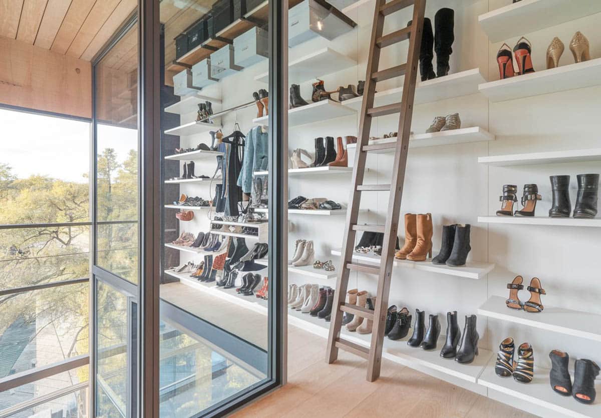Loft bedroom with wall rack with sliding ladder