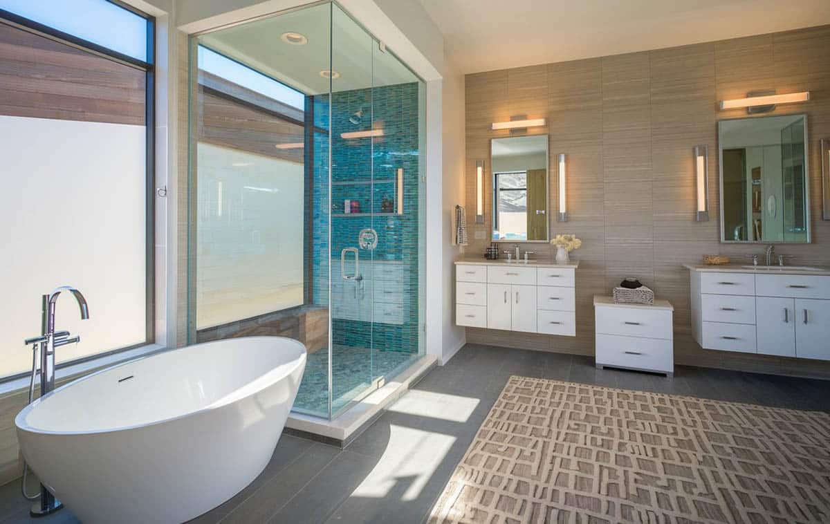 Luxury modern bathroom with aqua blue tile in shower