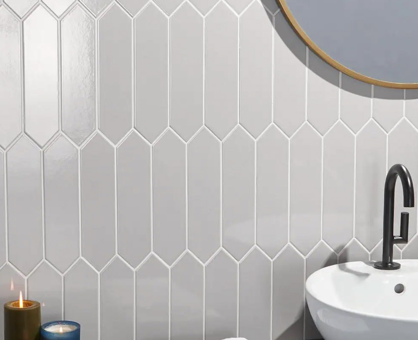 Vertical backsplash with sink and gray faucet