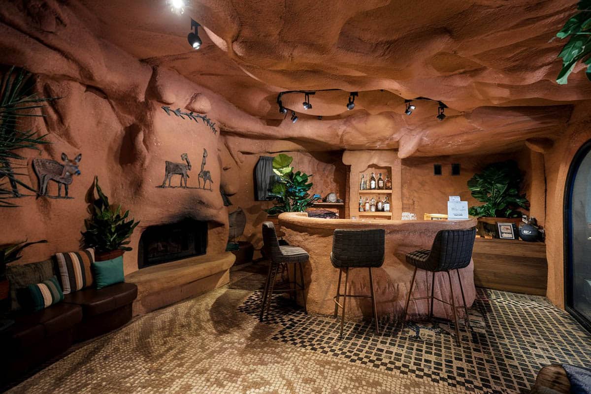 Custom cave with rock walls and drink bar