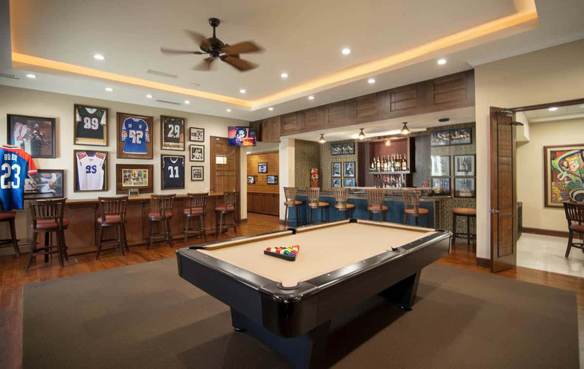 Wood bar, sports jerseys, sports decor and pool game