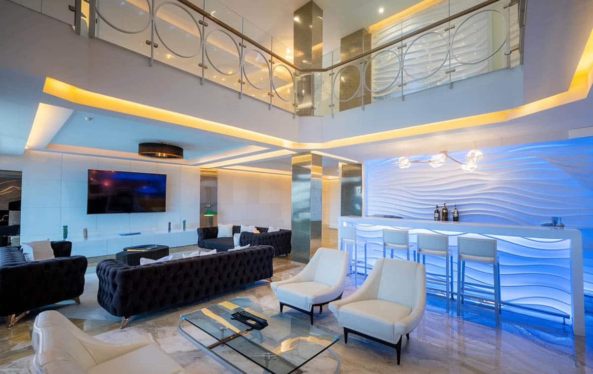 Modern neon room with stylish leather chairs in black and white