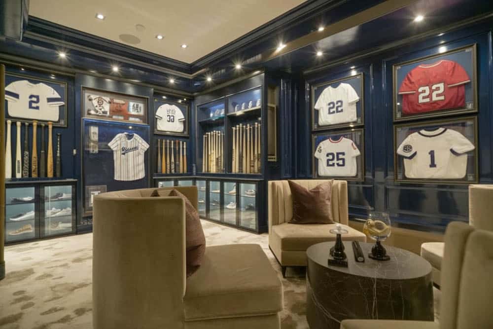 Sports-themed room memorabilia in display cases